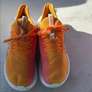 Hoka Vibrant Orange and Coral Sneakers